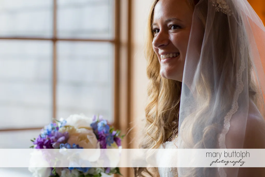 Bride smiles for the camera at the Lodge at Welch Allyn Wedding