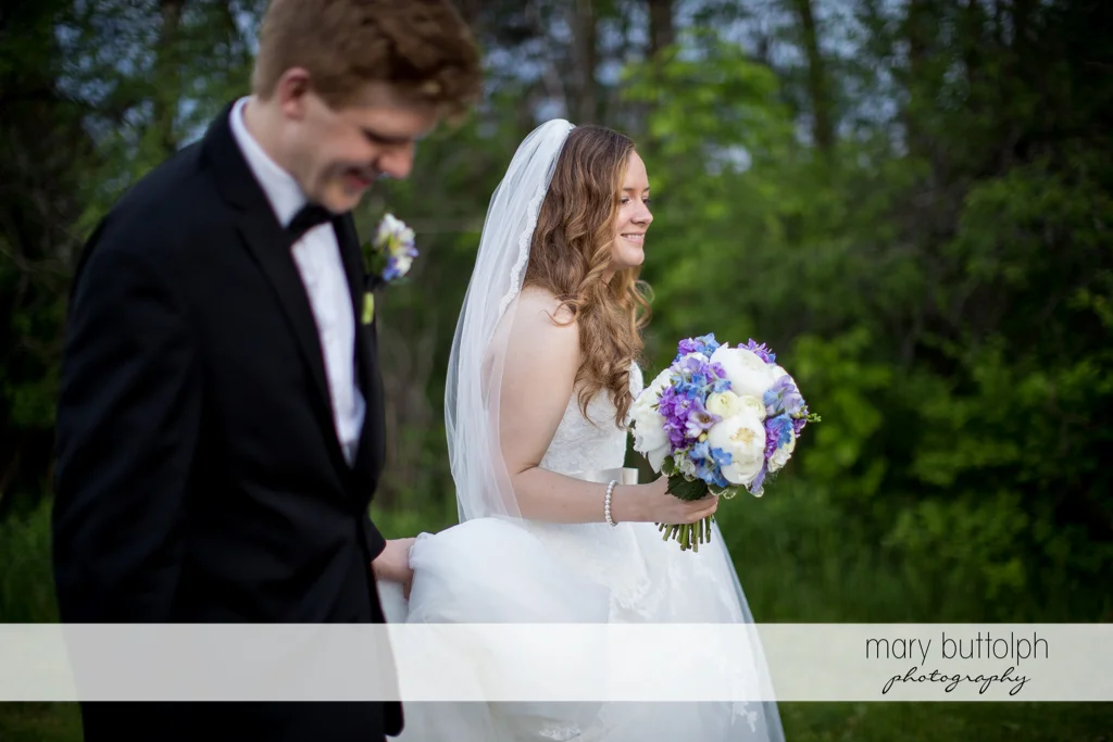 Couple stroll in the garden at the Lodge at Welch Allyn Wedding