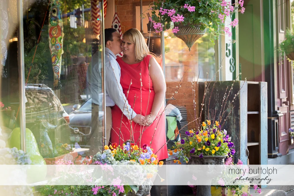 Couple visit a store decorated with flowers at Skaneateles Lake Engagement