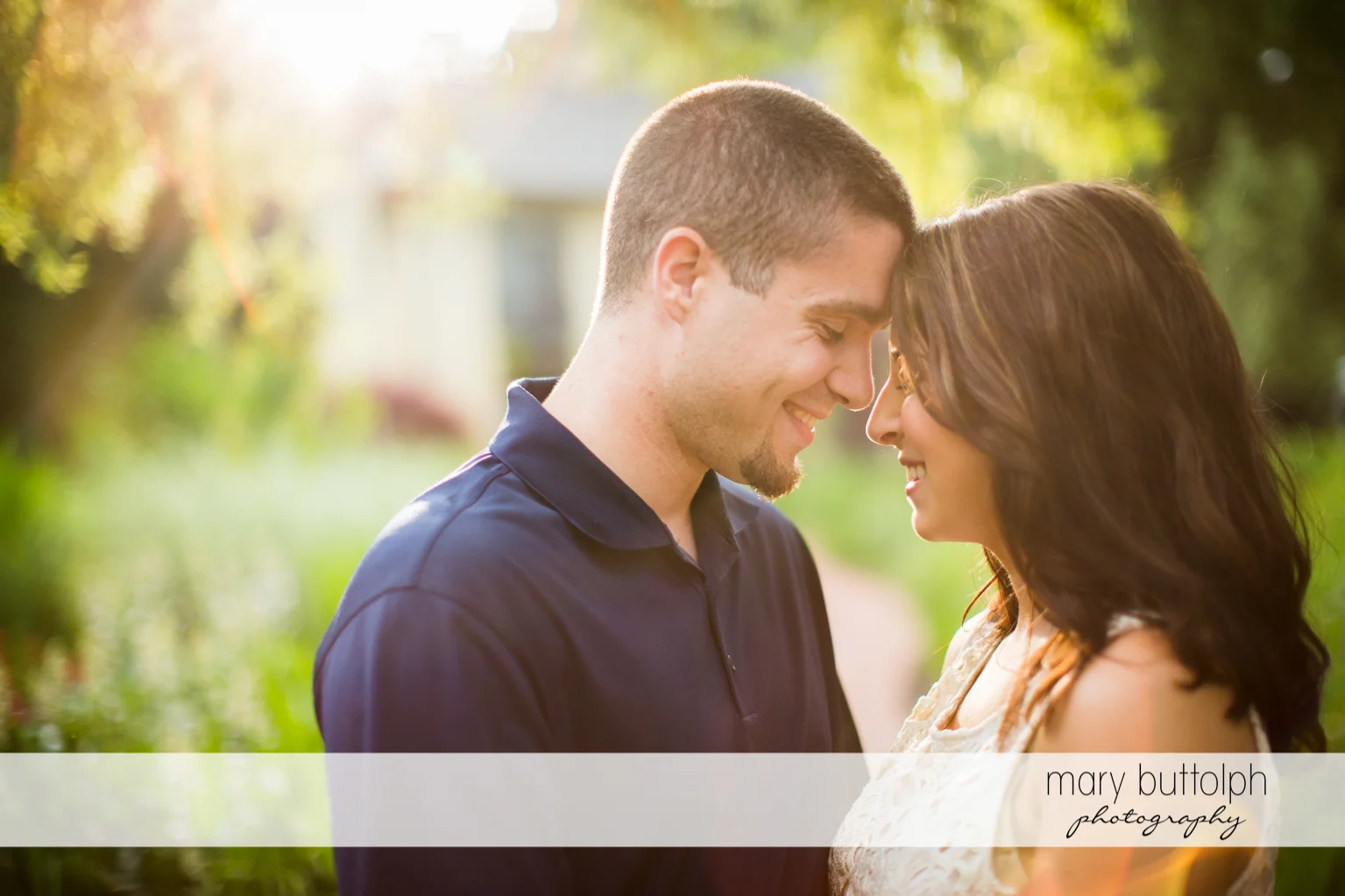 Couple pose in the garden at Skaneateles Engagement