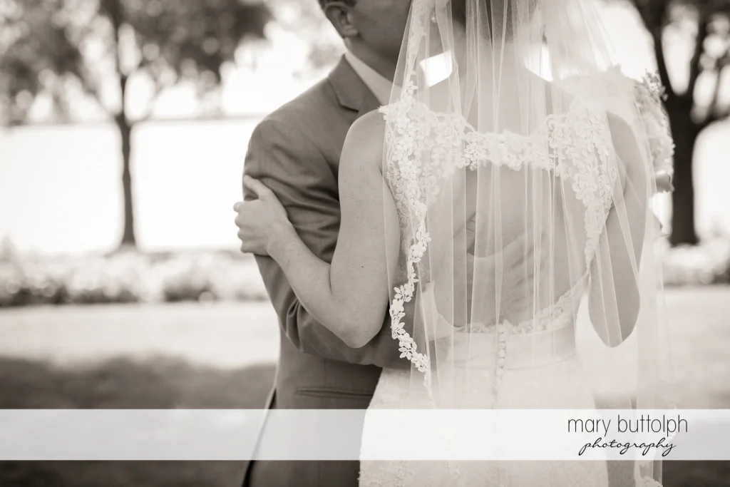 Couple spend time together near the lake at the Inns of Aurora Wedding