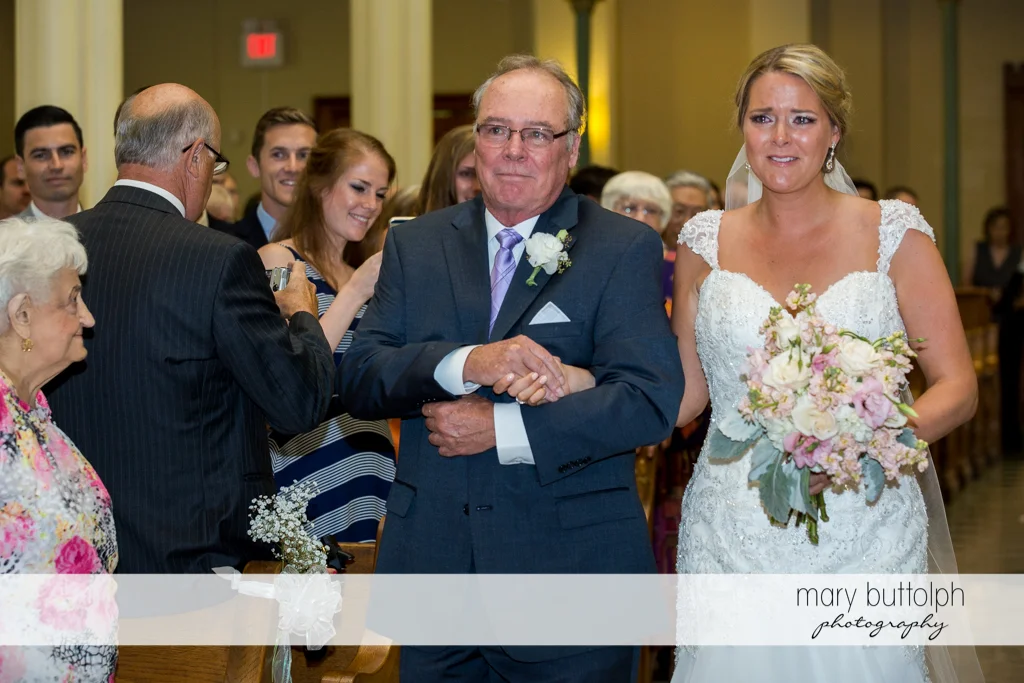Bride is teary-eyed as she walks down the aisle with her father at Emerson Park Pavilion Wedding