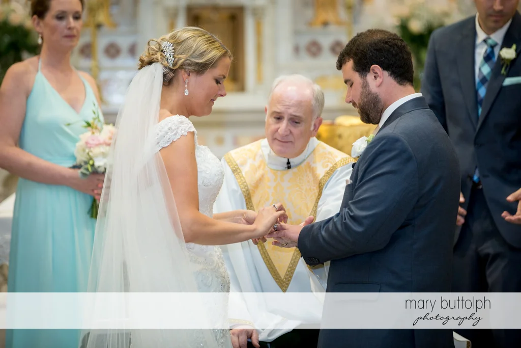Priest guides the couple during the wedding ceremony at Emerson Park Pavilion Wedding