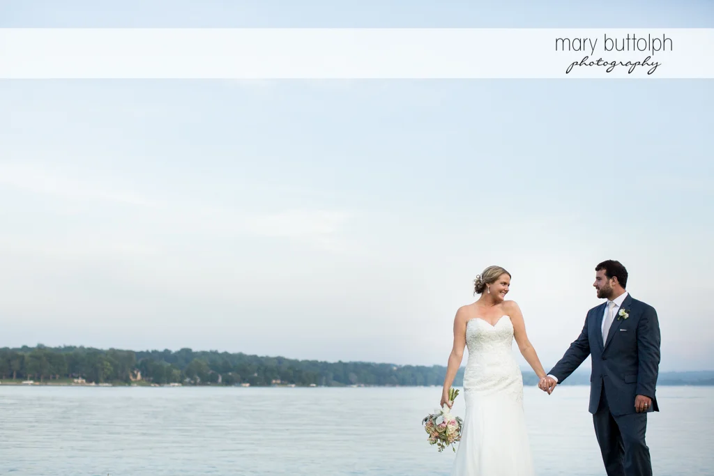 Couple stroll by the lake at Emerson Park Pavilion Wedding