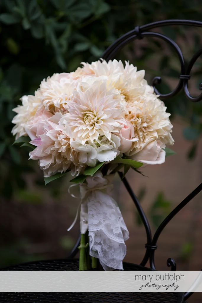 Close up shot of white flowers on a chair at Emerson Park Pavilion Wedding
