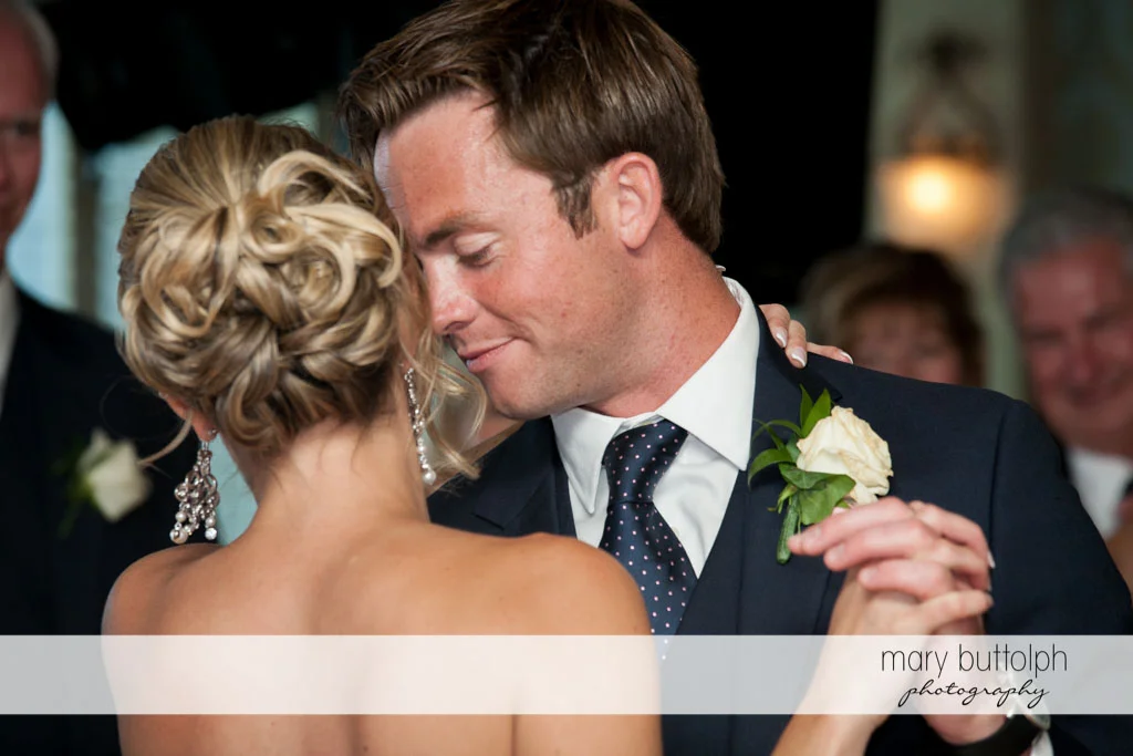 Couple dance cheek to cheek at Skaneateles Country Club Wedding