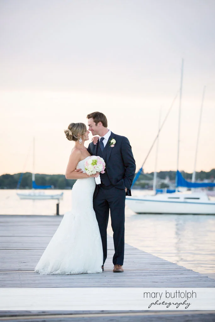 Couple stand near the lake at Skaneateles Country Club Wedding