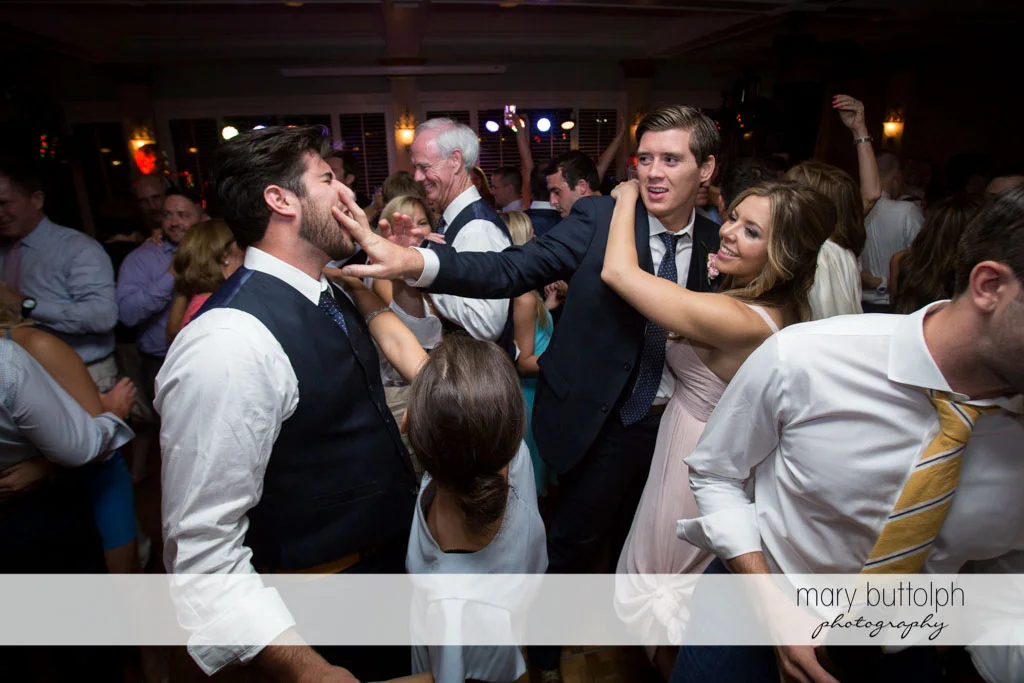 Groomsmen clown around on the dance floor at Skaneateles Country Club Wedding