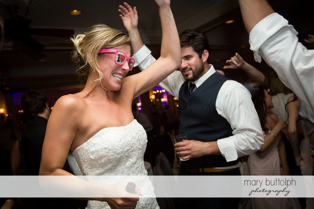 Bride in funny glasses lights up the dance floor at Skaneateles Country Club Wedding