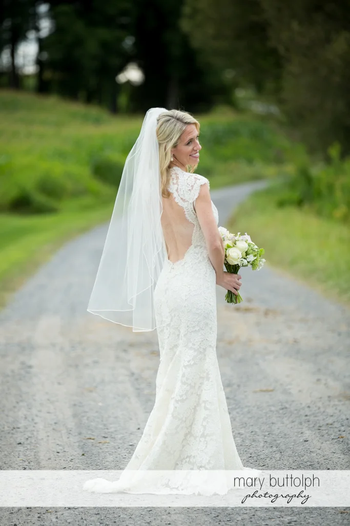 Bride on the road at Skaneateles Country Club Wedding