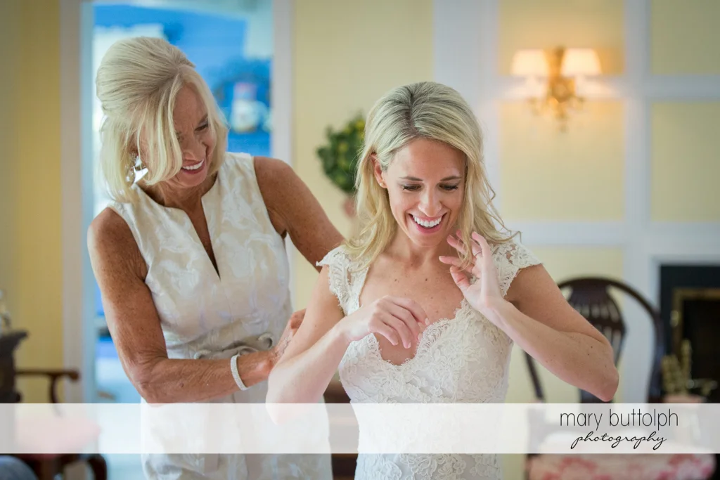 Bride and her mother share a happy moment at Skaneateles Country Club Wedding