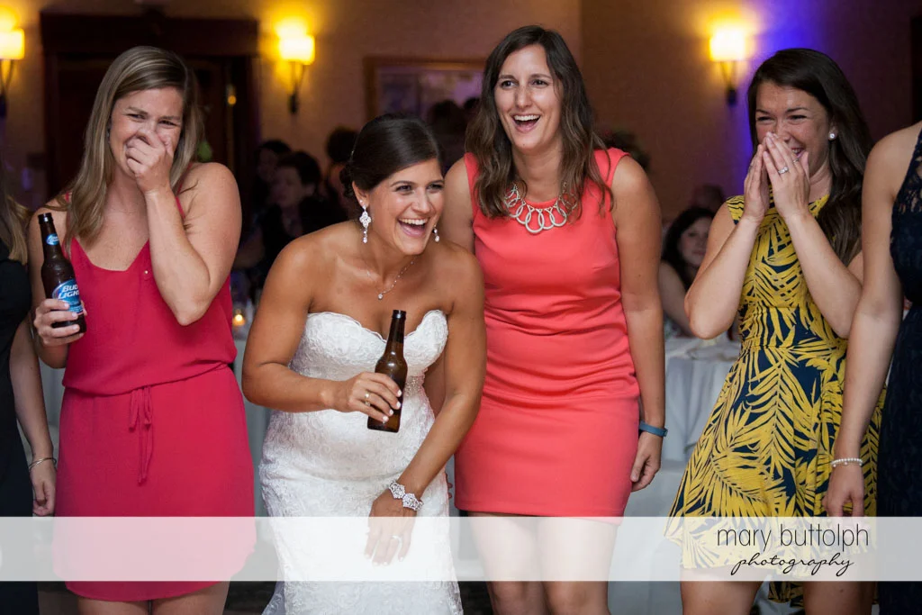 Bride and guests share a laugh at Turning Stone Resort Casino Wedding