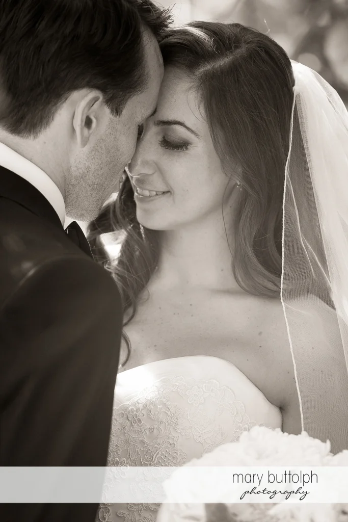 Couple rub noses in this dramatic black and white shot at the Brewster Inn Wedding