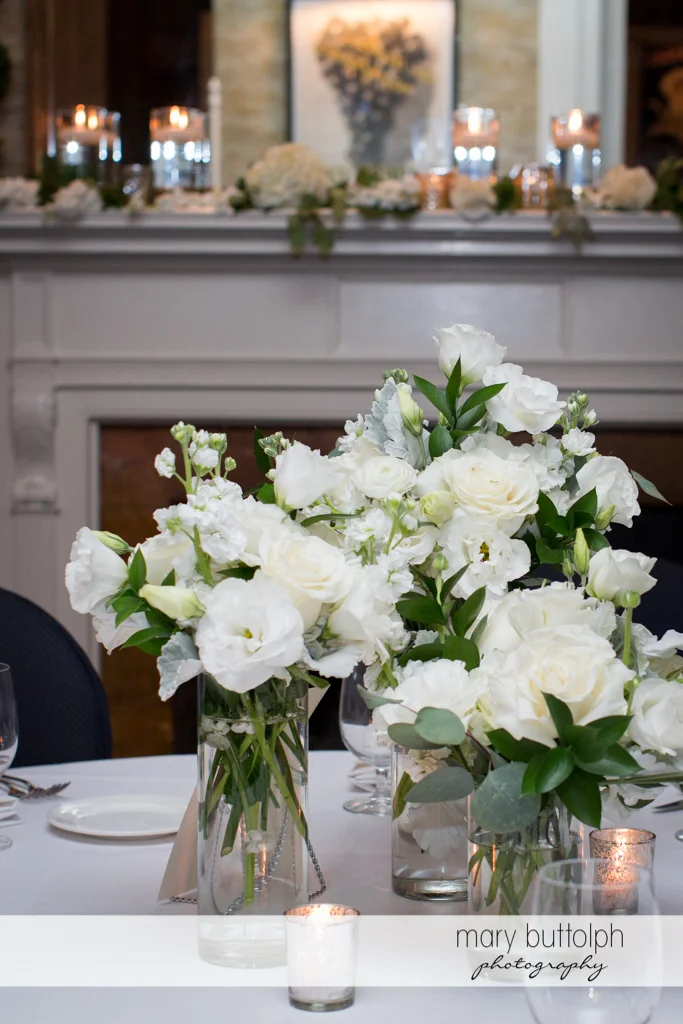 Bouquets add a touch of class to the tables at the Brewster Inn Wedding