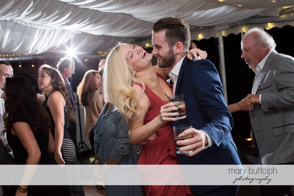Guests drink while dancing at the Inns of Aurora Wedding