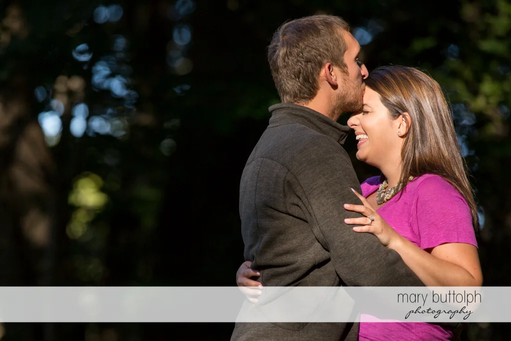 Couple in loving embrace at Marcellus Engagement