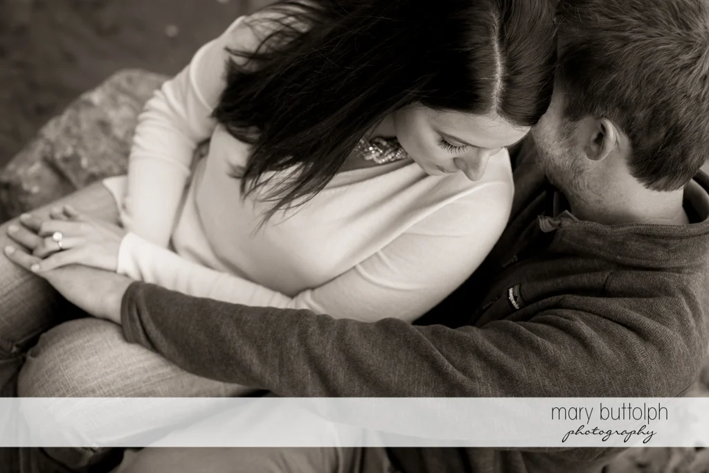 Couple sit by the lake in Marcellus Engagement