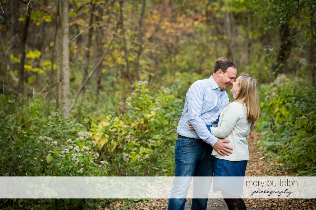 Couple embrace in the park at Erie Canal Engagement