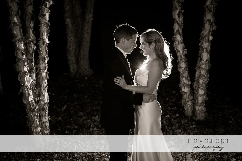 Couple surrounded by trees in the woods at the Lodge at Welch Allyn Wedding