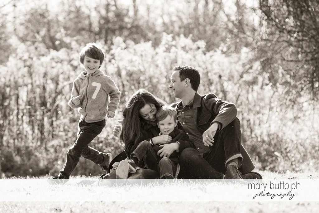 Family plays in the garden at Skaneateles