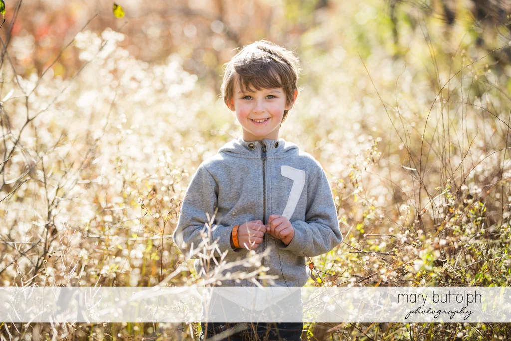 Boy poses in the garden at Skaneateles