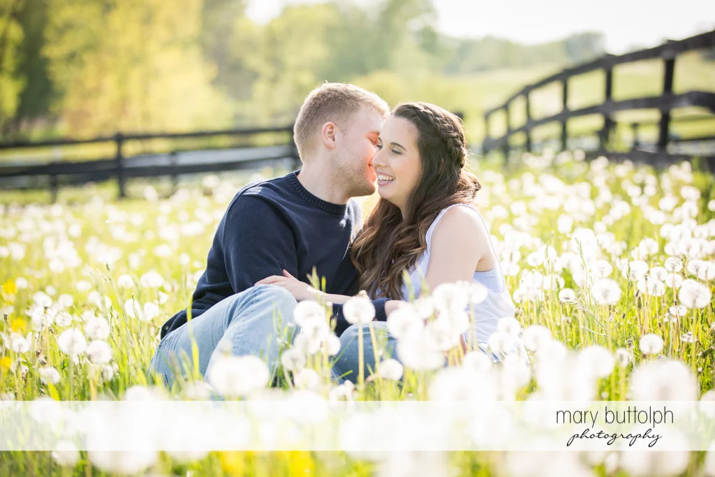 Couple relax in one of the beautiful gardens at Hobbit Hollow Engagement