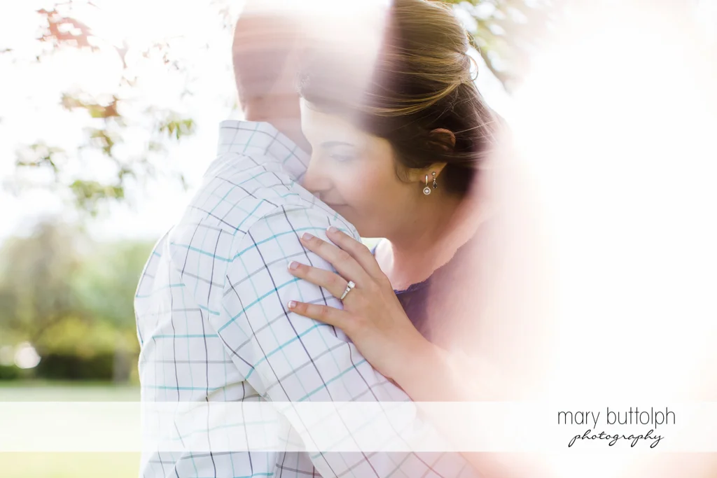 Couple shine in the sunlight at the park at Emerson Park Engagement
