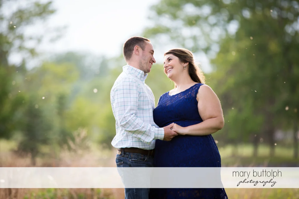 Couple smile at each other at Emerson Park Engagement