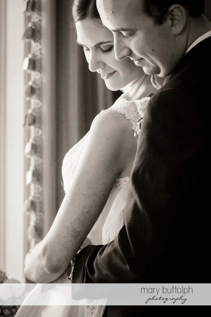 Close up shot of couple by the window at the Inns of Aurora Wedding