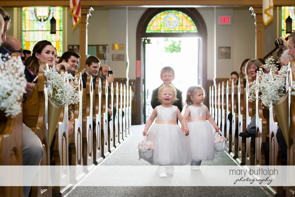 Flower girls and ring bearer walk down the aisle at the Inns of Aurora Wedding
