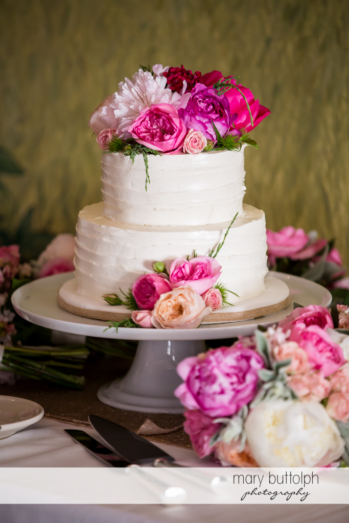 Couple's wedding cake on the table at the Inns of Aurora Wedding