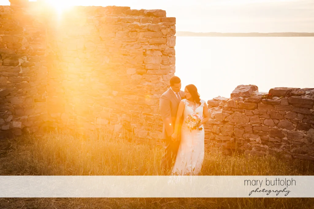 Couple stand in front of the ruins at the Inns of Aurora Wedding