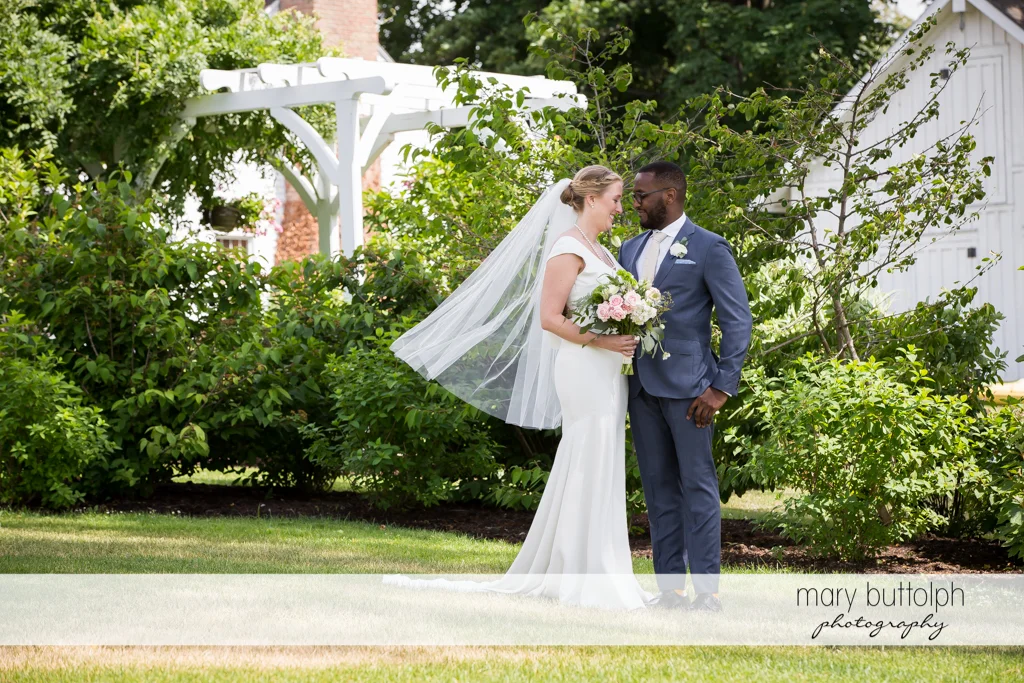 Couple pose in the garden at the Inns of Aurora Wedding