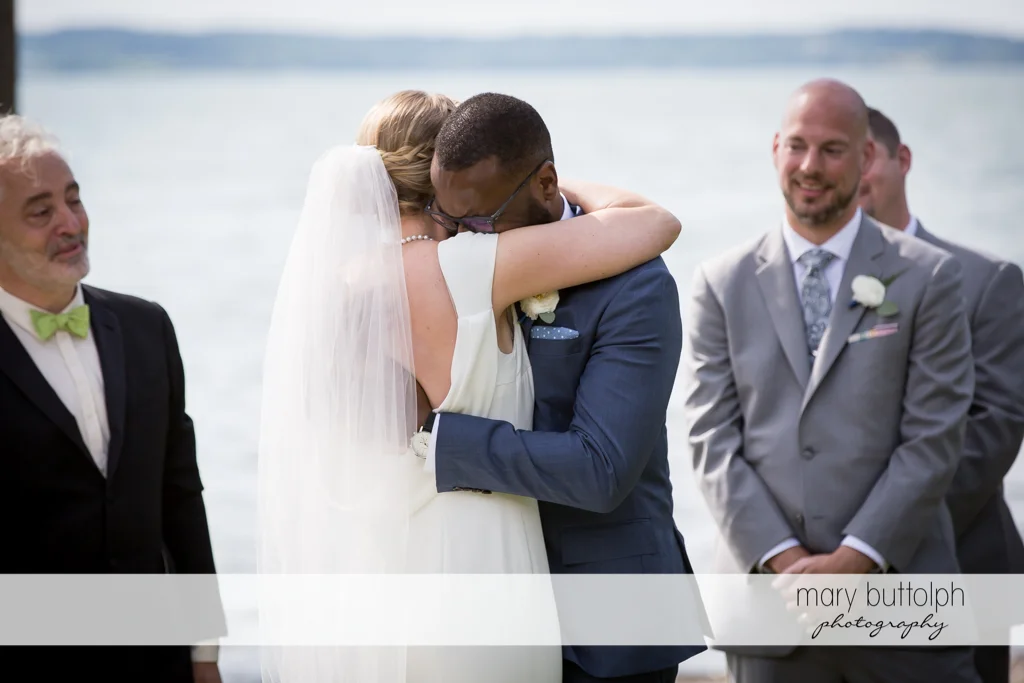 Couple embrace during the wedding ceremony at the Inns of Aurora Wedding