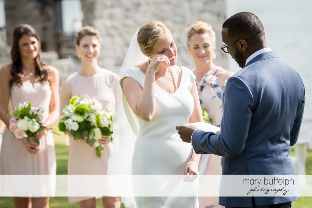 Bride holds back her tears during the wedding at the Inns of Aurora Wedding