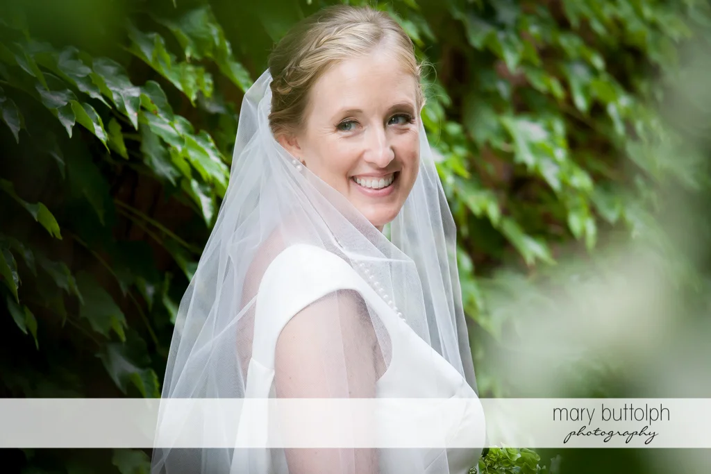 Bride in close up shot in the garden at the Inns of Aurora Wedding