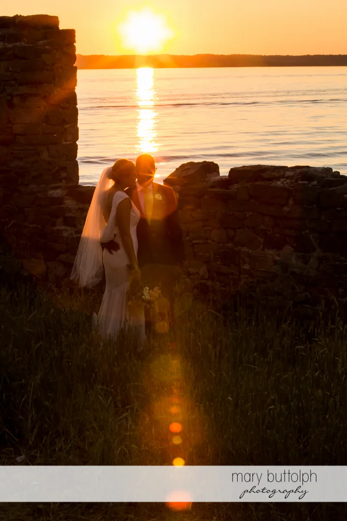 Couple watch the sunset at the Inns of Aurora Wedding