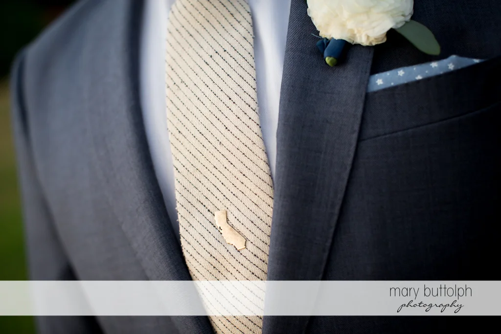 Close up of groom's tie pin at the Inns of Aurora Wedding