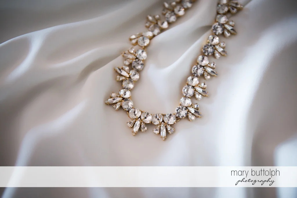 Close up shot of bride's beautiful necklace at the Inns of Aurora Wedding