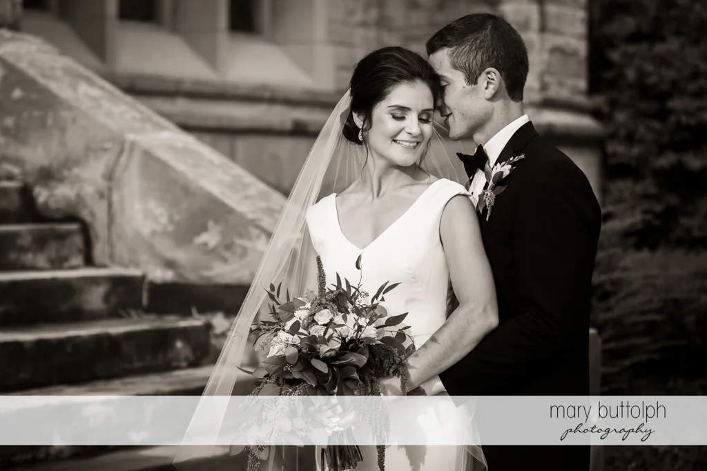 Couple pose near the stairway at Genesee Grande Hotel Wedding