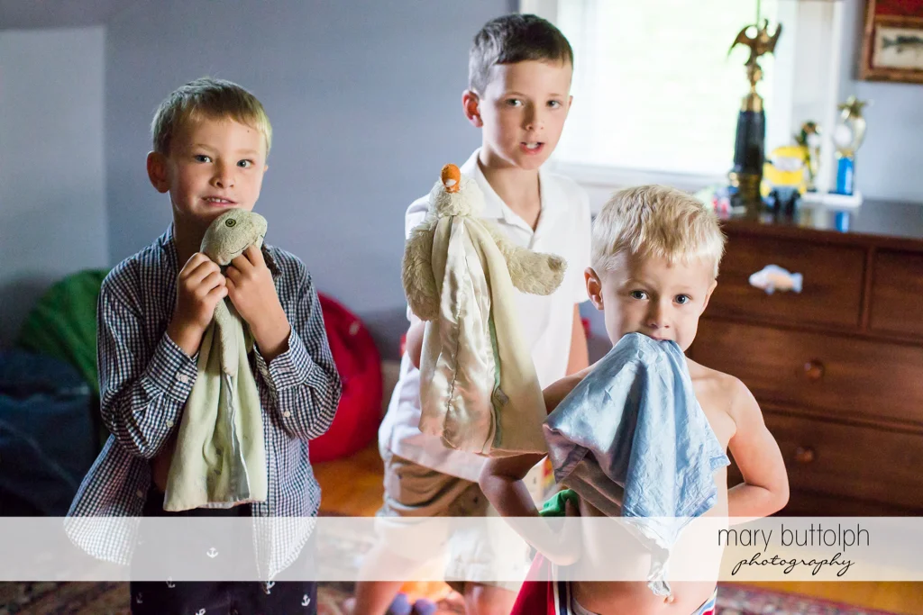 Brothers with their favorite towels in the bedroom at Skaneateles