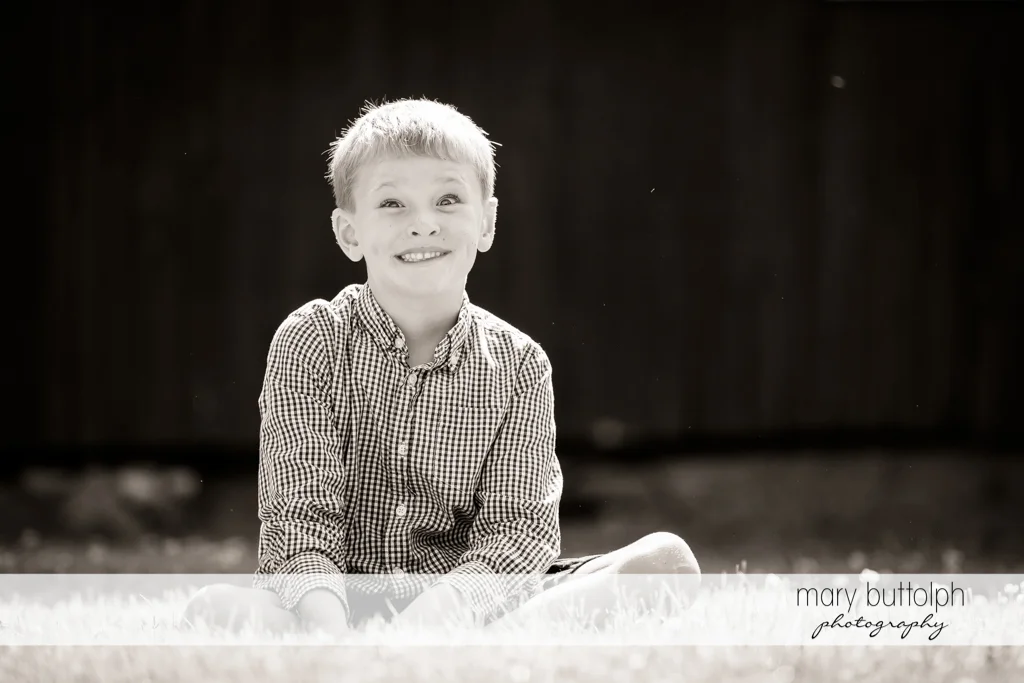 Crossed-eyed boy in the garden at Skaneateles