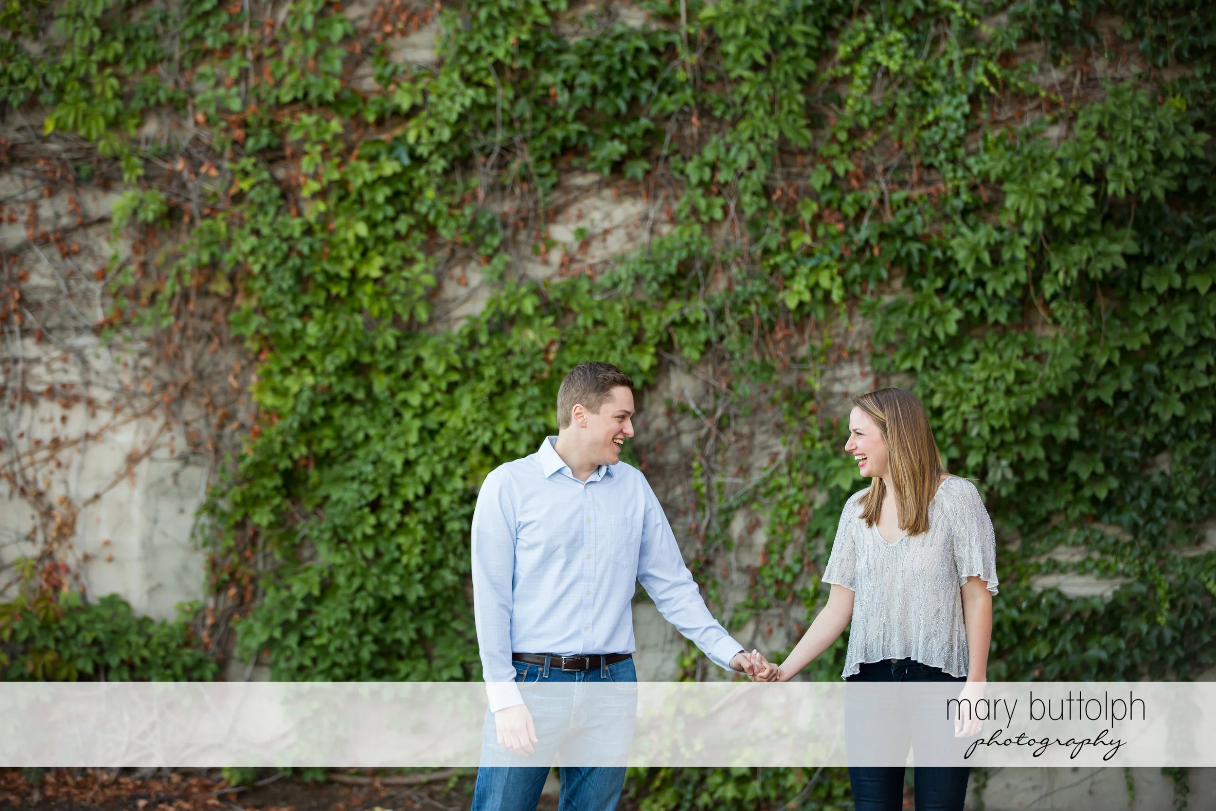Couple hold hands at Skaneateles Engagement