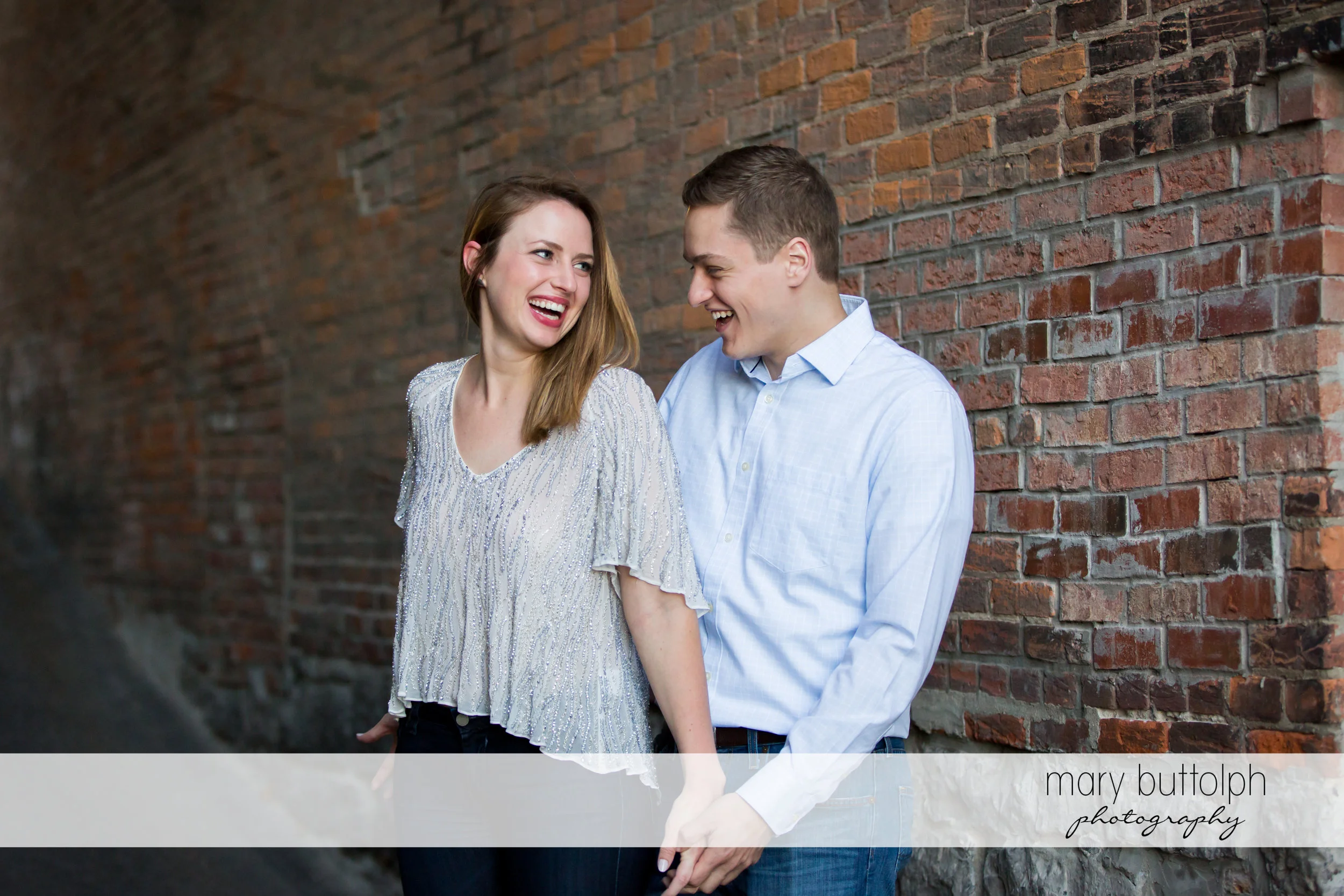 Couple laugh at Skaneateles Engagement