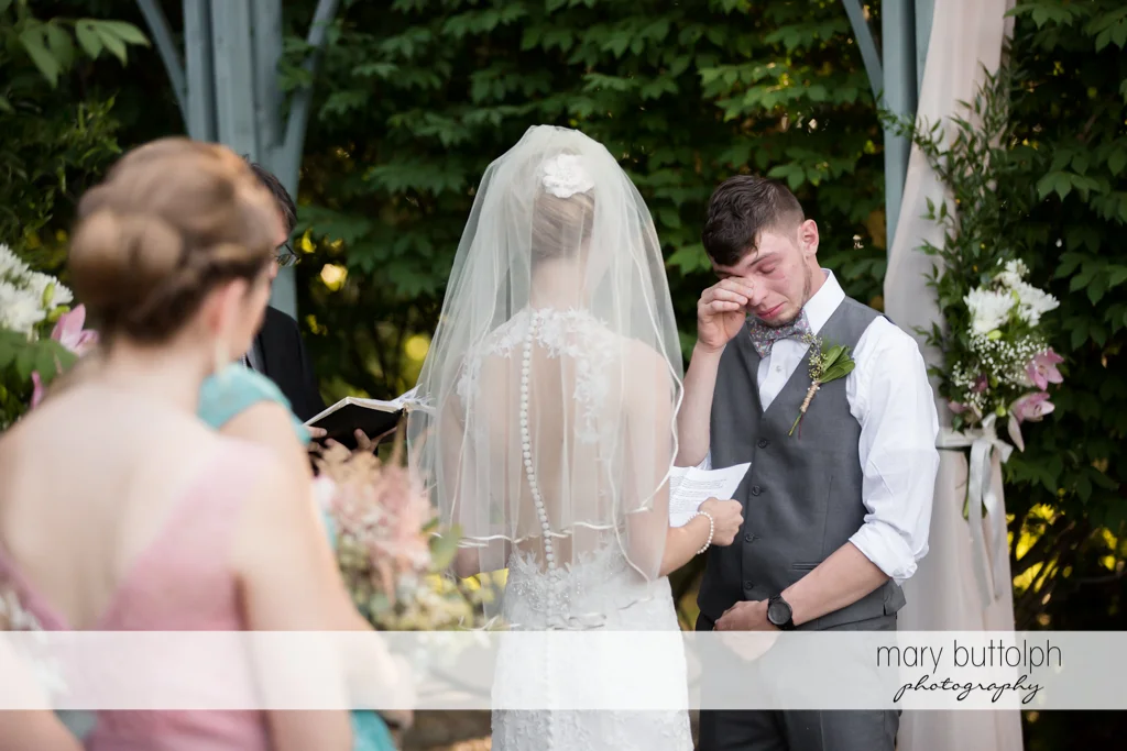 Groom cries at the garden wedding at John Joseph Inn and Elizabeth Restaurant Wedding