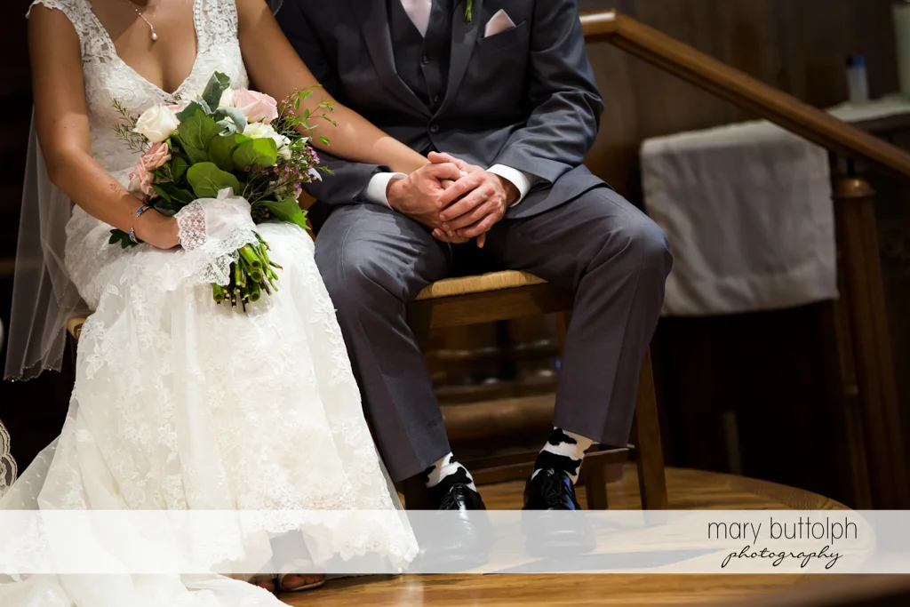 Couple hold hands during the wedding ceremony at The Lodge at Welch Allyn Wedding