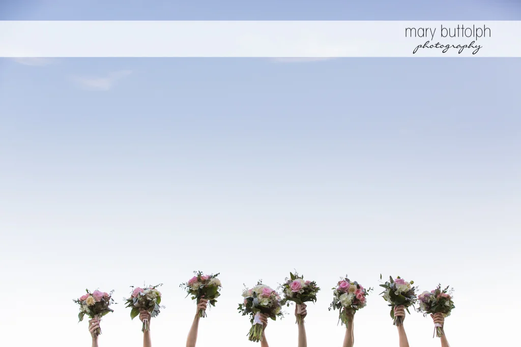 Wedding bouquets are raised at The Lodge at Welch Allyn Wedding
