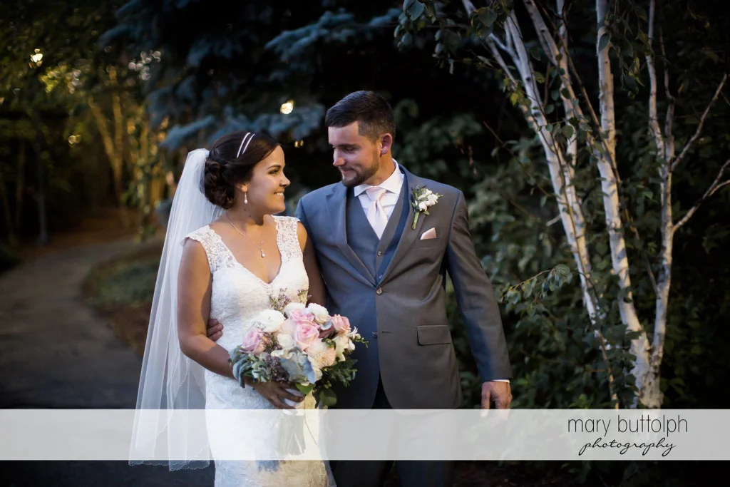 Couple take a quiet stroll after the wedding at The Lodge at Welch Allyn Wedding