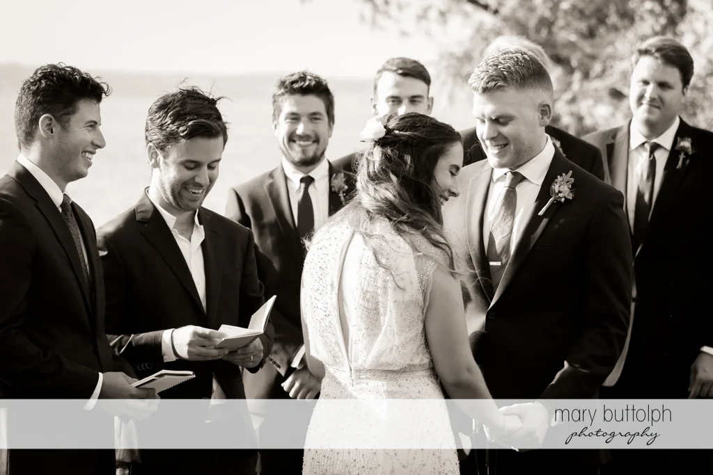 Couple in front of groomsmen at Aurora Inn Wedding