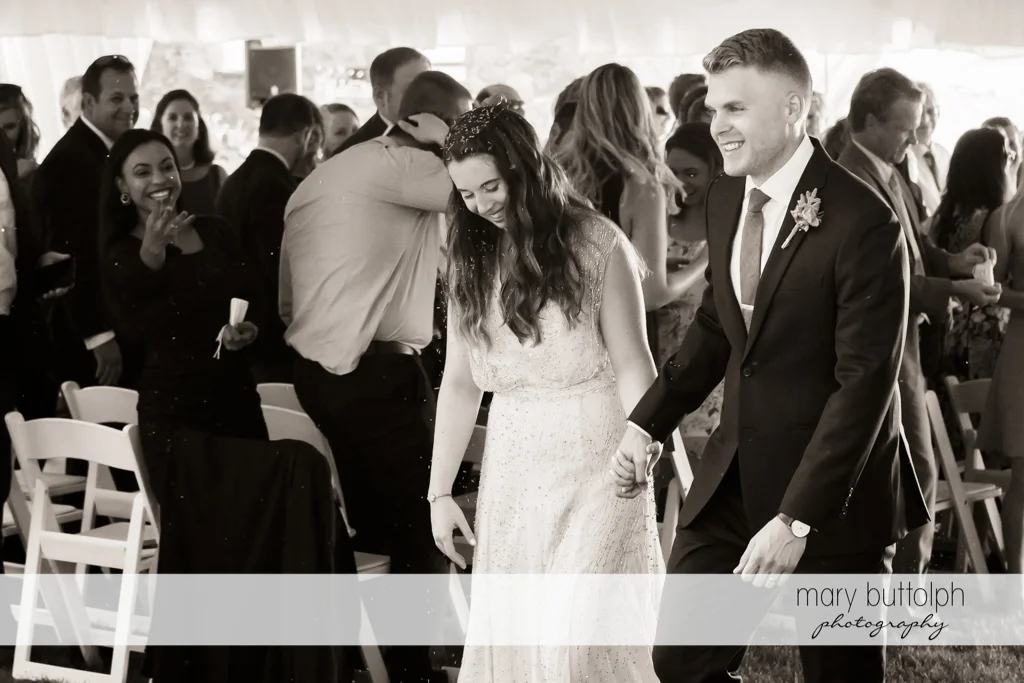 Couple walk down the aisle at Aurora Inn Wedding